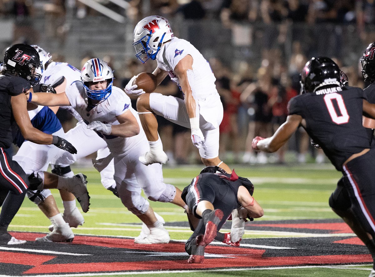 Stellar 📸 by <a href="/paulbrick/">Paul Brick</a> of <a href="/NathanAcosta_/">Nathan Acosta</a> <a href="/WLChapFootball/">Westlake Football</a> leaping over a Lake Travis defender during their rivalry showdown in Texas! View more 📷 from the game @SBLiveSports / <a href="/SBLiveTX/">Texas High School On SI</a> . highschool.si.com/texas/2023/09/…