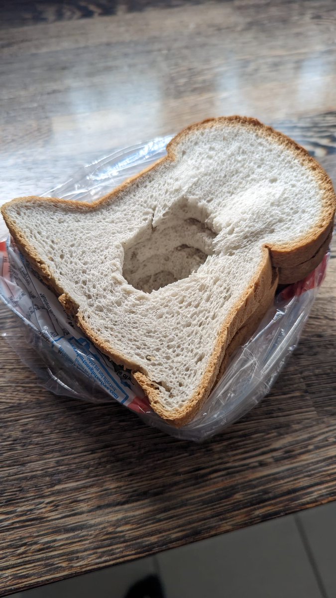 Buke_Laker's tweet photo. @warburtonsgf this is a disgrace, just look at the size of that hole! 😲 for the price I paid for this loaf, this is not what I expect. I won't be purchasing a Warburton's gluten free loaf again after this! #HoleyWarburtons #WarburtonsGF @Warburtons https://t.co/iiNPSNmiZL