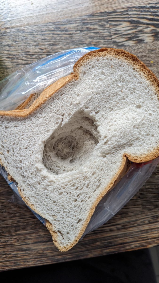 Buke_Laker's tweet photo. @warburtonsgf this is a disgrace, just look at the size of that hole! 😲 for the price I paid for this loaf, this is not what I expect. I won't be purchasing a Warburton's gluten free loaf again after this! #HoleyWarburtons #WarburtonsGF @Warburtons https://t.co/iiNPSNmiZL