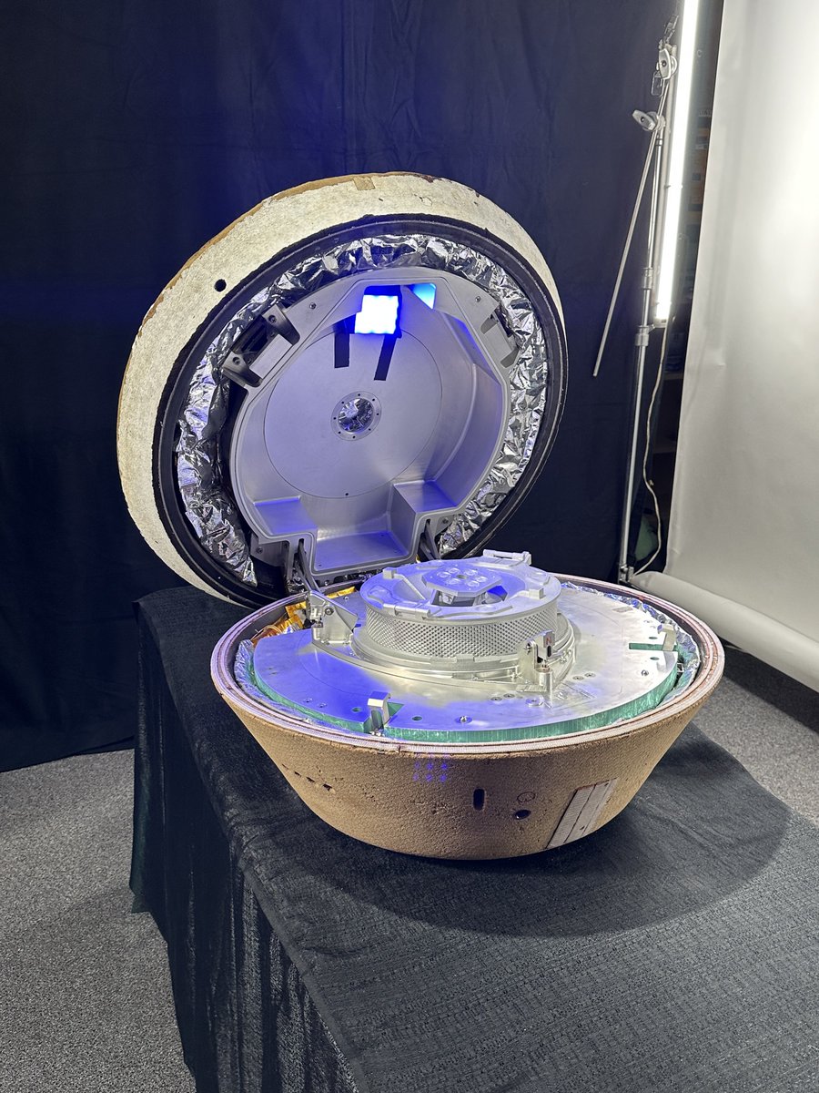 This is a replica of what is landing back on earth tomorrow. The canister in the middle is filled with asteroid regolith- the largest sample of an extraterrestrial body since Apollo 17. Who knows what is waiting to be discovered within it. <a href="/LMSpace/">Lockheed Martin Space</a>