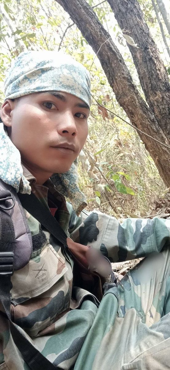 nomangkha's tweet photo. What’s happening!!? 

Who’s this with a “Bhartiya Sena” military dress?

@adgpi @official_dgar is he one of your boys? Bringing this to your notice that the photo is being circulated along with other photos of Kuki Militants. Kindly help us in debunking the rumours. https://t.co/a3pT2dbBjF