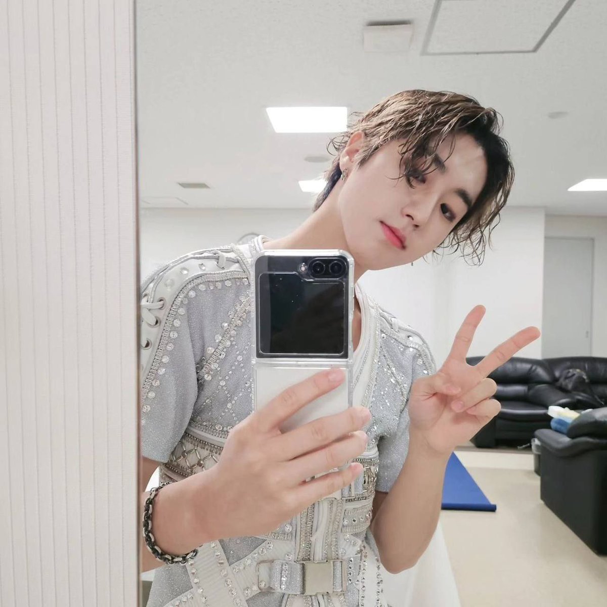 With the sleek Samsung Flip by my side, I'm channeling some seriously captivating and handsome vibes in this mirror selfie. There's just something about the crisp display and sleek design that takes mirror selfies to the next level. Who's with me on this?