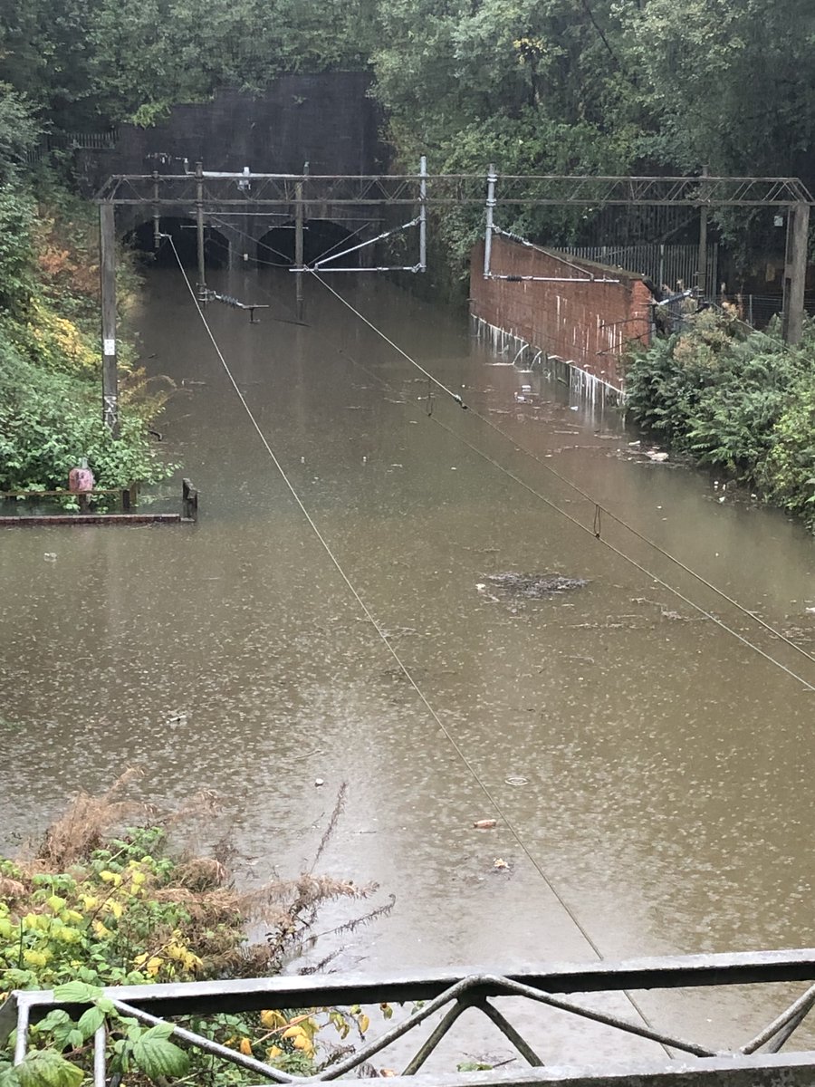 NetworkRailSCOT's tweet image. Here’s the state of play at Dalmuir Twin Tunnels. As you can see, the water level is massive – it’s up to around the window level on a train. The fixed pumps here have been completely overwhelmed by the extreme rainfall. It'll take time for this to clear once the rain stops.