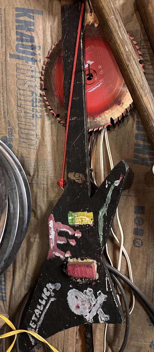 My dad built me this #airguitar for a talent show in grade school. It has seen many paint jobs in my brothers and my youth. @greenery808 was the last to provide the current iteration of 80s metal magic. 
#childhoodmemories #dad #lovingparents #bestdadever  #youth #superiorwi