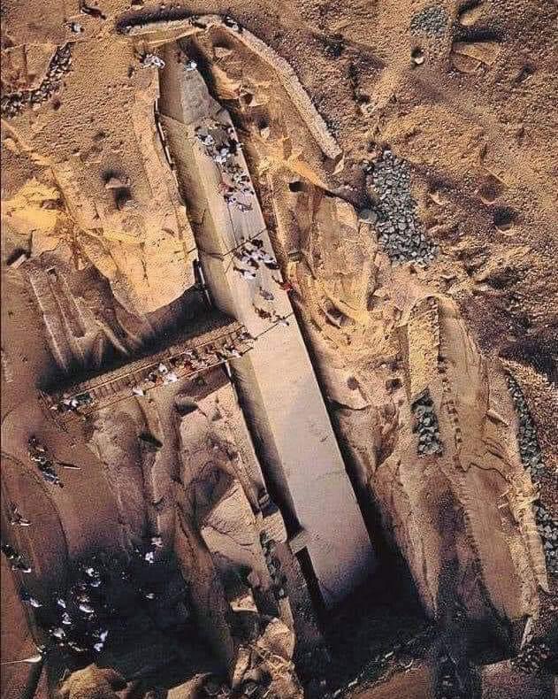 An aerial view of the 'Unfinished Obelisk' in the 3500-year-old granite quarry in Aswan, Egypt. The unfinished obelisk is nearly one-third larger than any ancient Egyptian obelisk ever erected. This obelisk, which is 25m long today, if it had been finished by the ancient