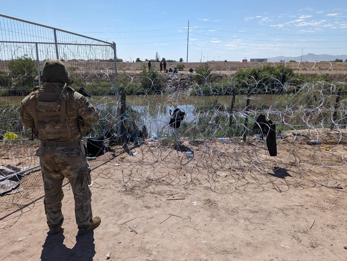 TXMilitary's tweet photo. The Texas National Guard continues to post at areas along the Texas-Mexico border to deter and detect trans-national criminals entering the United States illegally. Engineers on Operation Lone Star have placed miles of concertina-wire fencing to stop illigal immigrants. https://t.co/oO8iC2GB05
