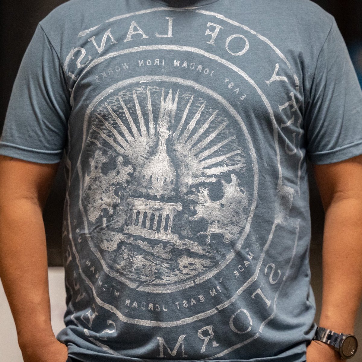 LansingClothing's tweet photo. Don’t miss out on this “Lansing Sewer Cap” Tshirt restock – it’s your chance to wear a piece of the city’s unique charm. Perfect for urban explorers and trendsetters! #lovelansing https://t.co/4nTu5vz10g