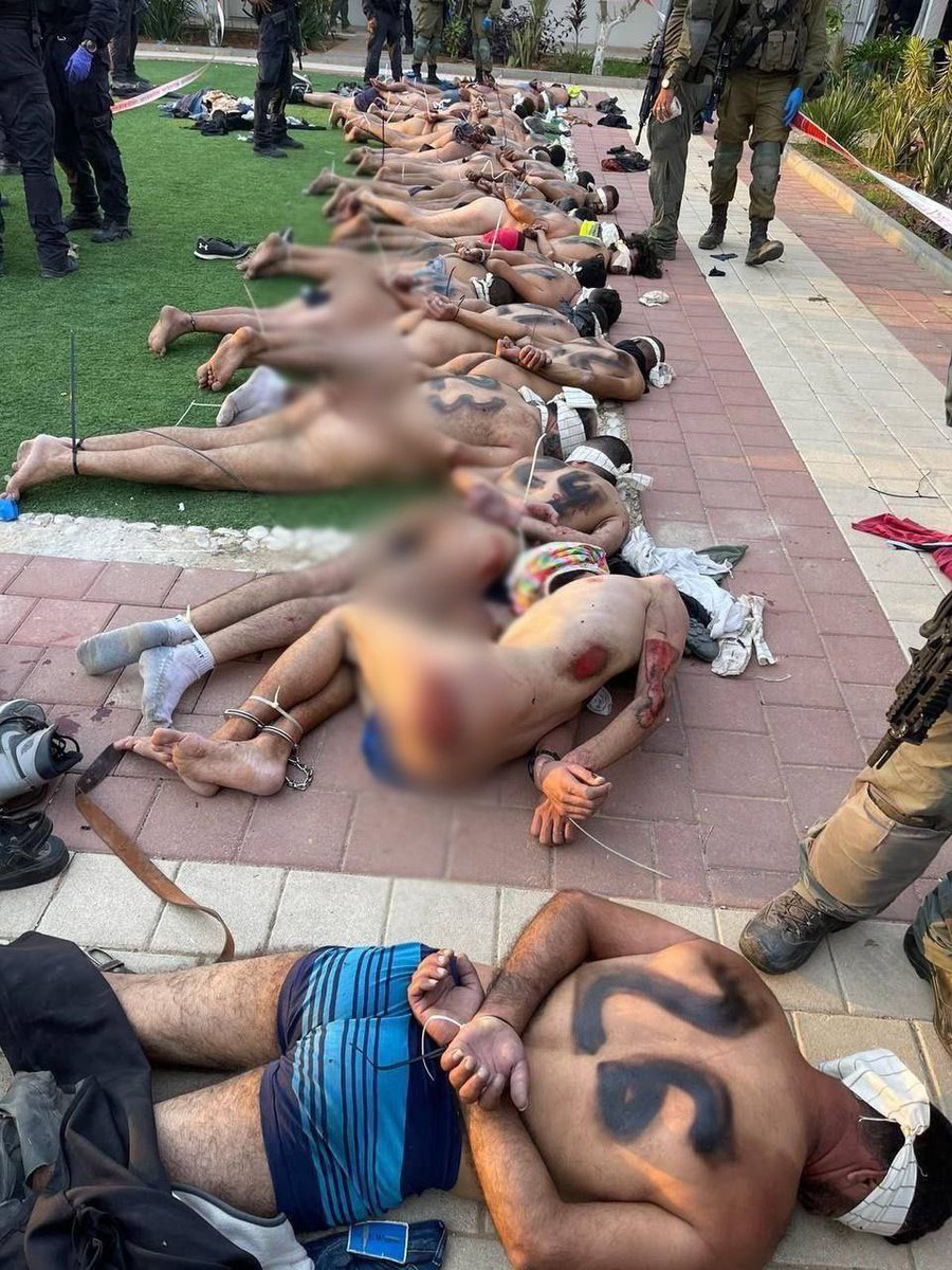 Israeli soldiers stripped the captured Palestinians naked and then tortured them & also writing numbers on their backs.