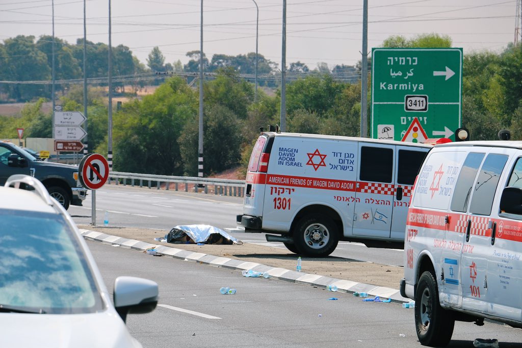 TreyYingst's tweet photo. Warning: Disturbing photos

What I saw in southern Israel today. 

1. Paramedics declare an Israeli soldier dead after trying to revive him.

2. Plumes of smoke rise from the horizon after direct rocket hits.

3. The body of a Palestinian militant is covered in foil.

4. Israeli soldiers prepare their gear after arriving at the Gaza border.