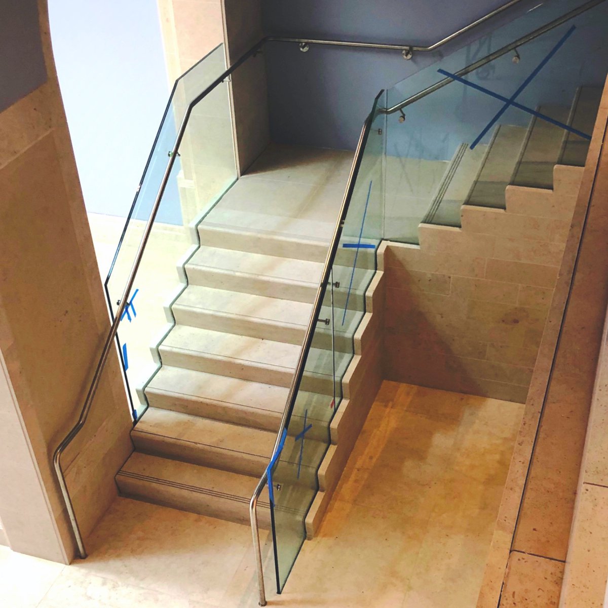 impressioncorp's tweet image. The warmth of the limestone beautifully complements the transparency of the glass banister, creating a stunning focal point for any location.