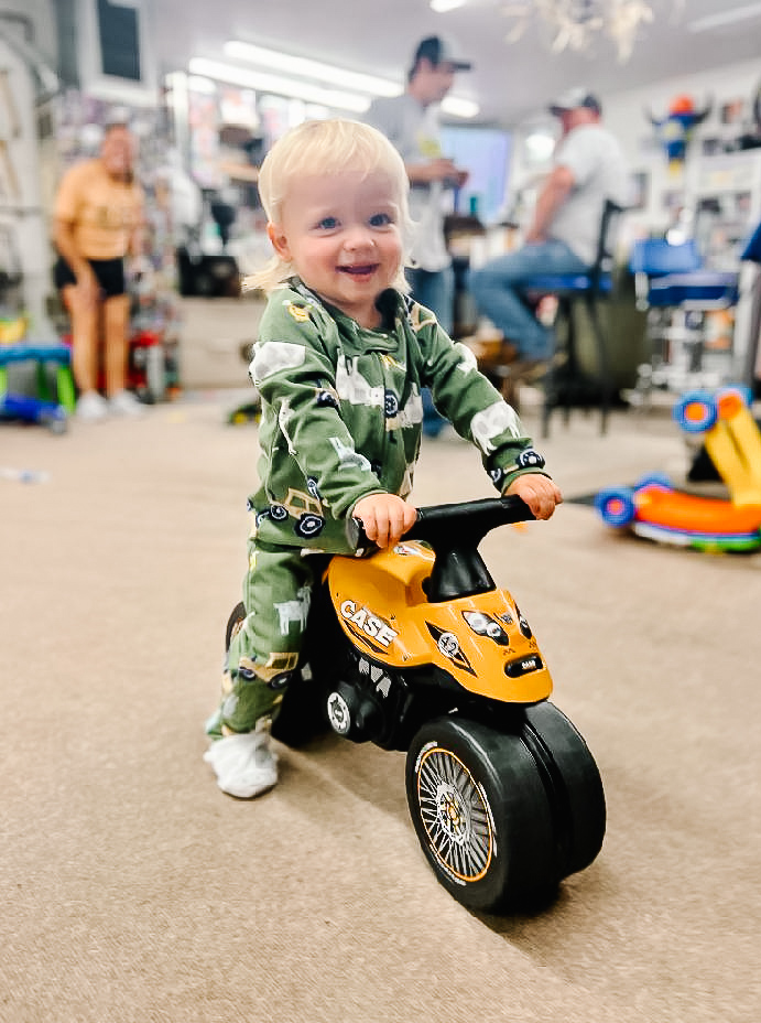 It's hard to go to sleep when you have BIG places to go! 

General Manager, Matt Leighton of our Titan Machinery - Sioux Falls location tired to get his grandson, Bo, to settle down for the night but Bo was having too much fun riding around on his CASE scooter!