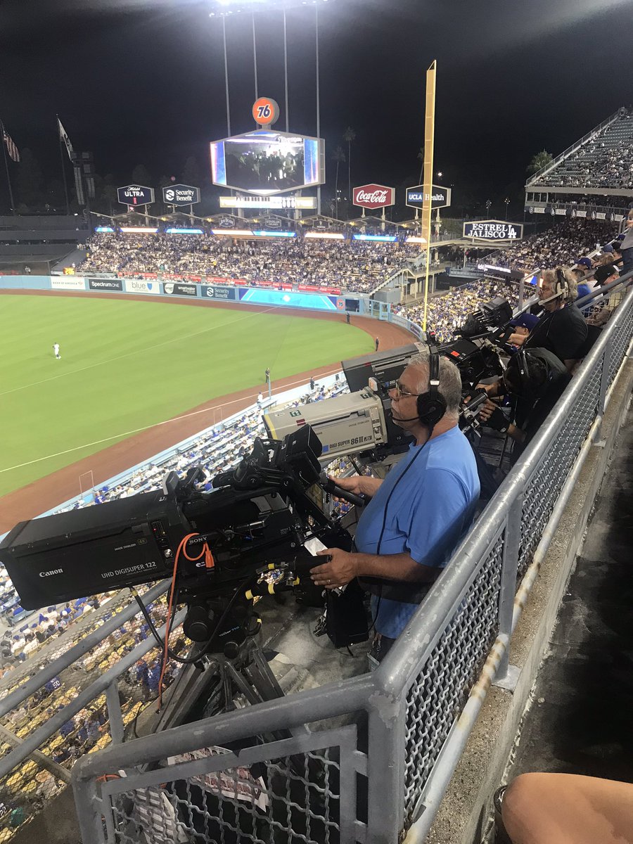 I’m sitting right behind the first base camera bank at Dodgers-DBacks game. Right now, it’s more interesting watching them than the 9-0 DBacks blowout.
