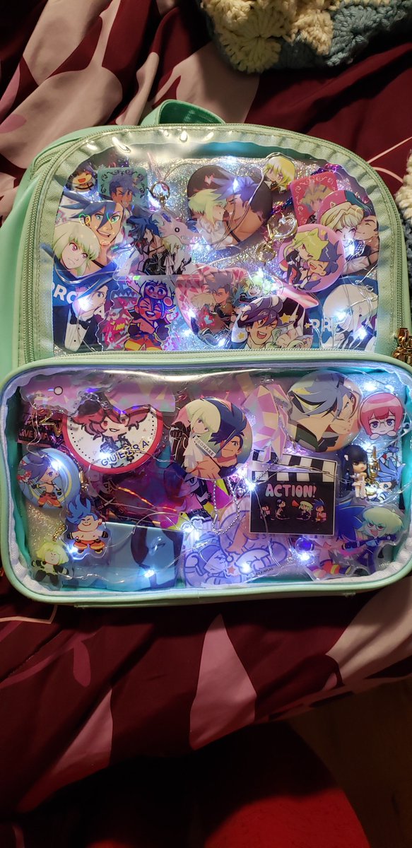 firetrailed's tweet image. whenever i get sad missing promare i just smile remembering that hiromi wakabayashi has a picture of my promare ita bag on his phone