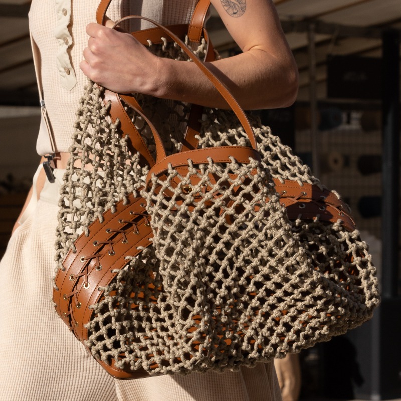 StellaMcCartney's tweet photo. STELLA’S SUSTAINABLE MARKET: Crafted details. Vegan #Frayme bags with knotted mesh and corset lacing, alongside hand-crocheted mirrored denim.
Discover the full #StellaSummer24 runway collection at https://t.co/KHxLwY08aR.
#StellaMcCartney #PFW #vegan #crueltyfree