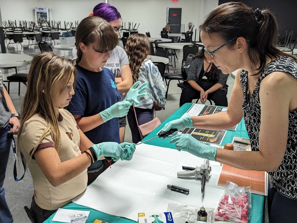 At the Forensic Science Event hosted by SU 10 Girl Scouts made evidence SWAPs, learned about firearm and tool mark forensic science, did chemistry experiments, and practiced fingerprint collection. DPS and APD lab members also spoke and answered questions about their jobs.