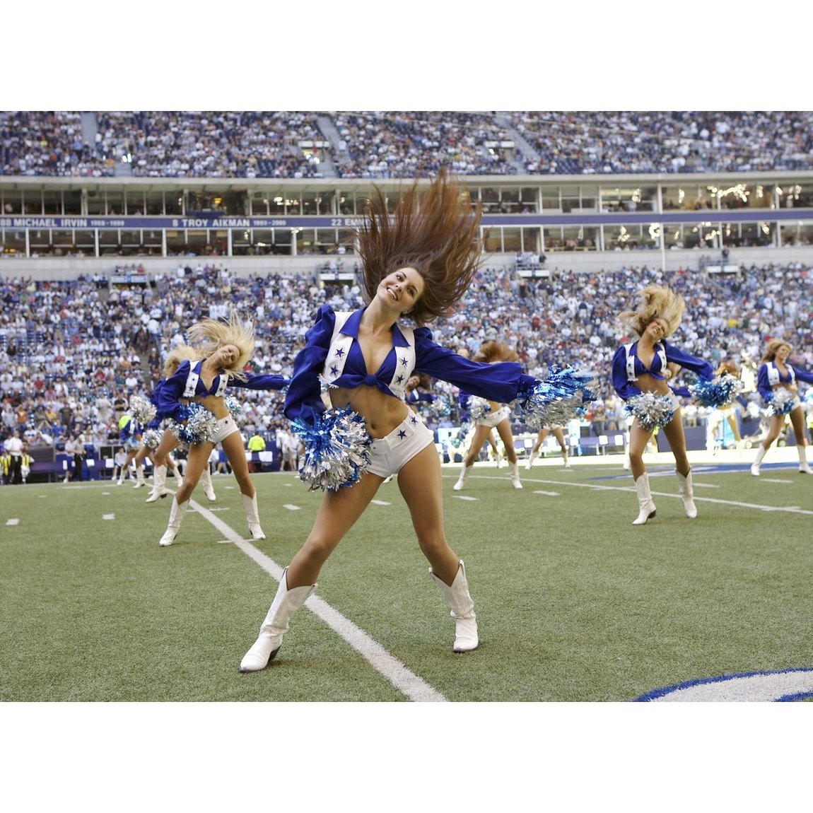 Dallas Cowboys cheerleaders perform before a game against the Philadelphia Eagles at Texas Stadium. Irving, Texas. October 9, 2005. #NeilLeifer #Photography #Dallas #Cowboys #Philadelphia #Eagles #Football #Cheerleaders