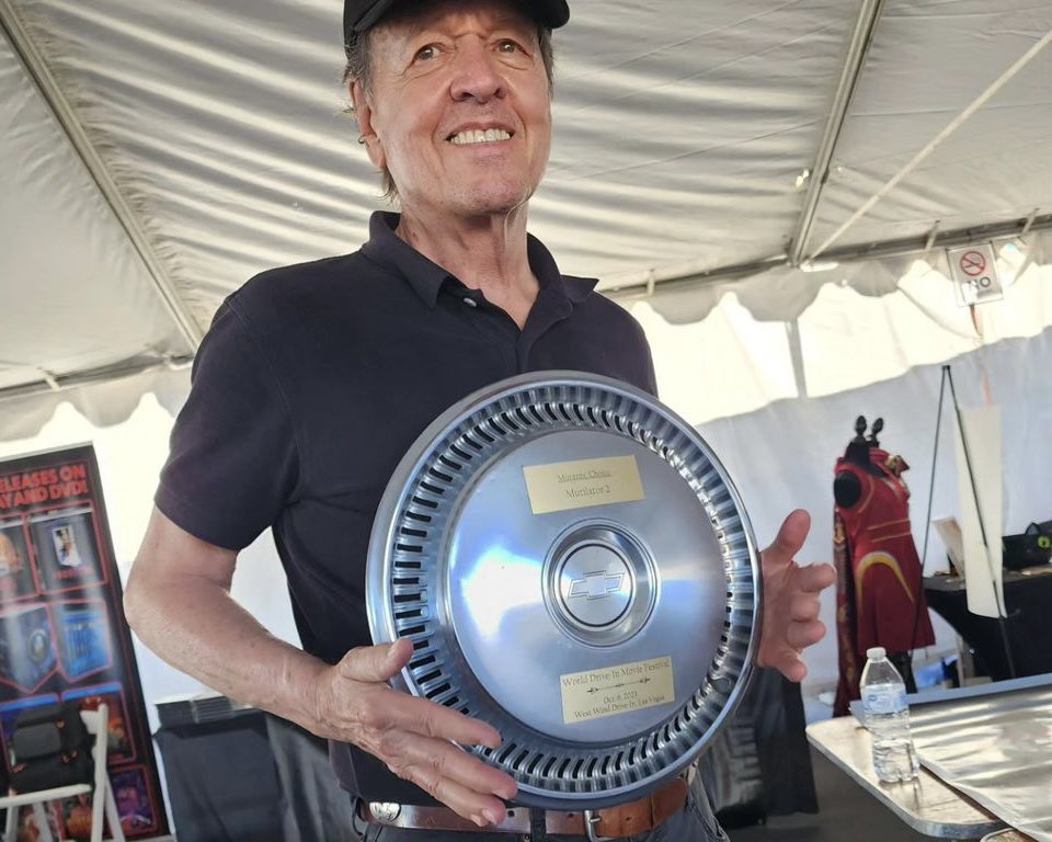 Ry4nJ4m3s's tweet photo. Writer/Director Buddy Cooper receiving @therealjoebob’s “Hubbie” Award for @MutilatorTwo, presented on a Chevy hubcap! #Mutilator2 https://t.co/x5QbS7pMXF