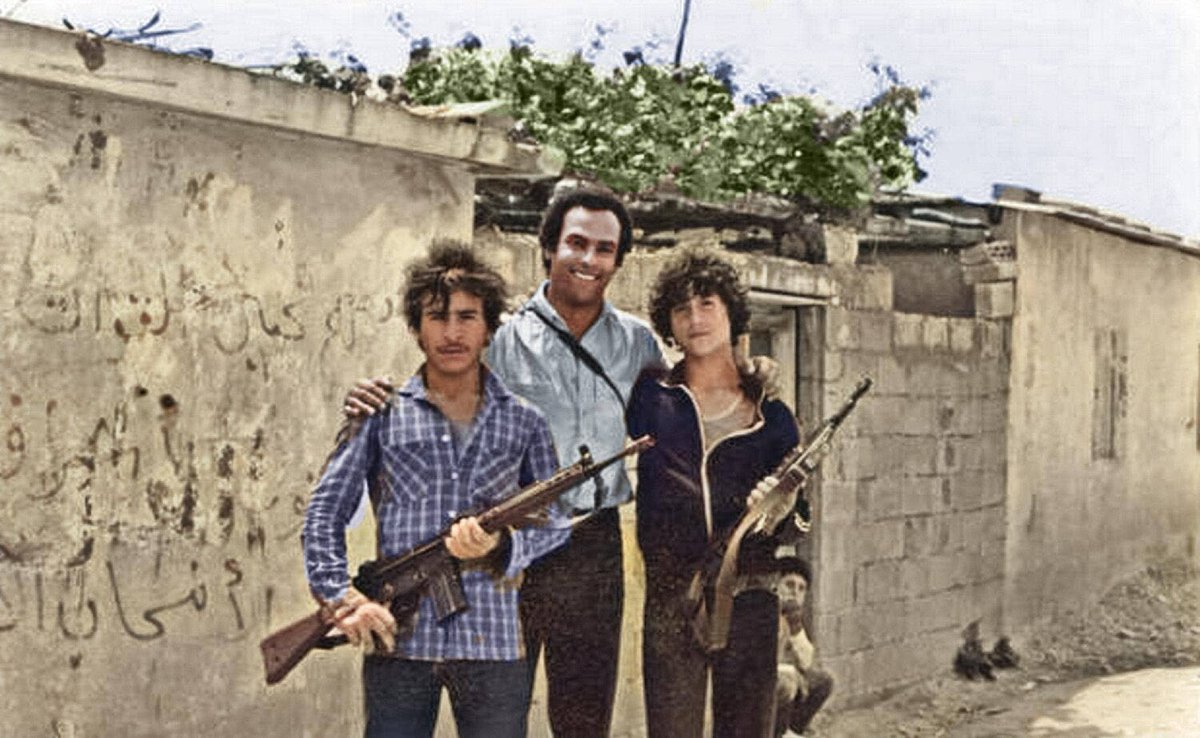 Huey P. Newton of the Black Panther Party for Self-Defense outside of a Palestinian refugee camp in Lebanon (1980)