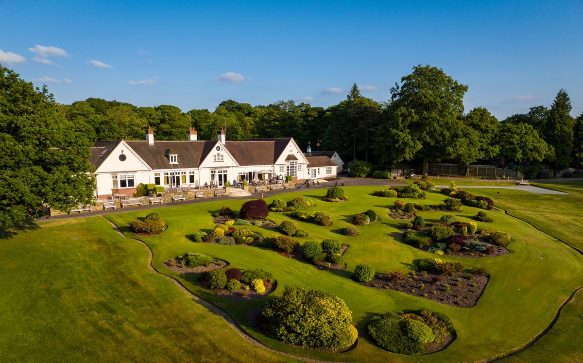 Our clubhouse and putting green. 
 
Quite the pair.