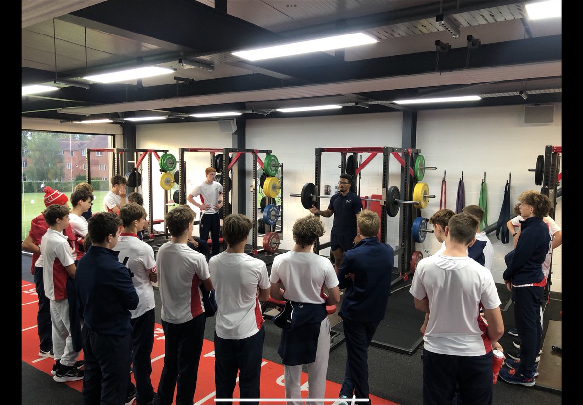 One of the J15 groups discussing with Mr Samuda about back squat set up, spotting, and dropping of the bar. An important safety component to give the boys confidence when lifting in the future. Will implement into practice throughout the academic year.