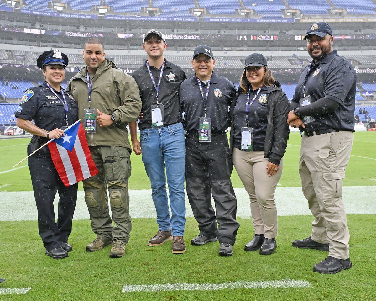 BaltCoPolice's tweet photo. Thank you to the 💜@ravens for honoring some of our members!! Shown (l. to r.) are @baltimoredpolice members, @harford_sheriff Deputy M. Cortes IV, his father, #BCoPD Major M. Cortes III, #BCoPD Det. J. Calle, and #BCoPD Ofc. H. Pomales.#hispanicheritagemonth #seatsforservice https://t.co/aVi7apffKu