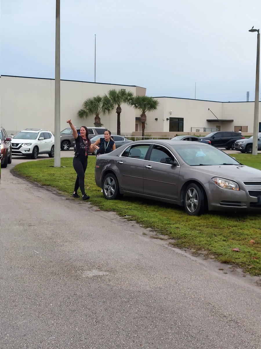 Ms. Chica and Ms. Kachele helping a stranded  parent at drop off this morning.  They pushed her car on the grass and jumped the car. #vbevibe  
@verobeachelem