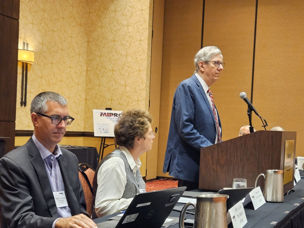 MW_Rail's tweet photo. #MIPRC Chair @SenatorMcGinn & Vice Chair Peter Anastor (@MDOT_Rail director) listen to @NormalILL Mayor, & @Amtrak Board nominee, Chris Koos as he opens @MW_Rail's 2023 Annual Meeting by describing #passengerrail's role as a catalyst for his city's economic growth. #AmtrakMidwest https://t.co/6zng5lDirE