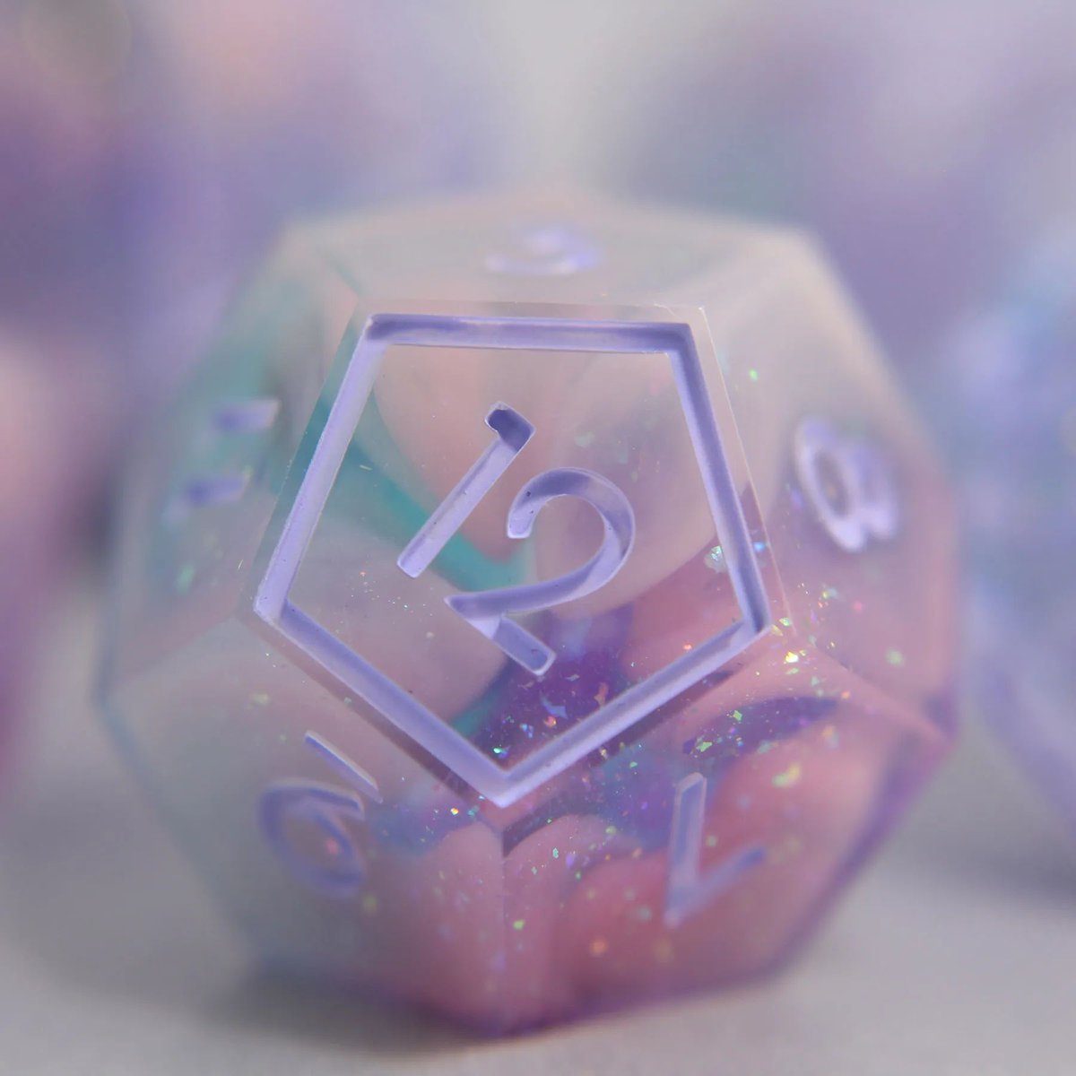 Pastel Sunset: gentle clouds drift towards the horizon on a cool breeze, signaling a changing of the seasons.

This dice set will be available in my shop update this Saturday at 12pm EST!