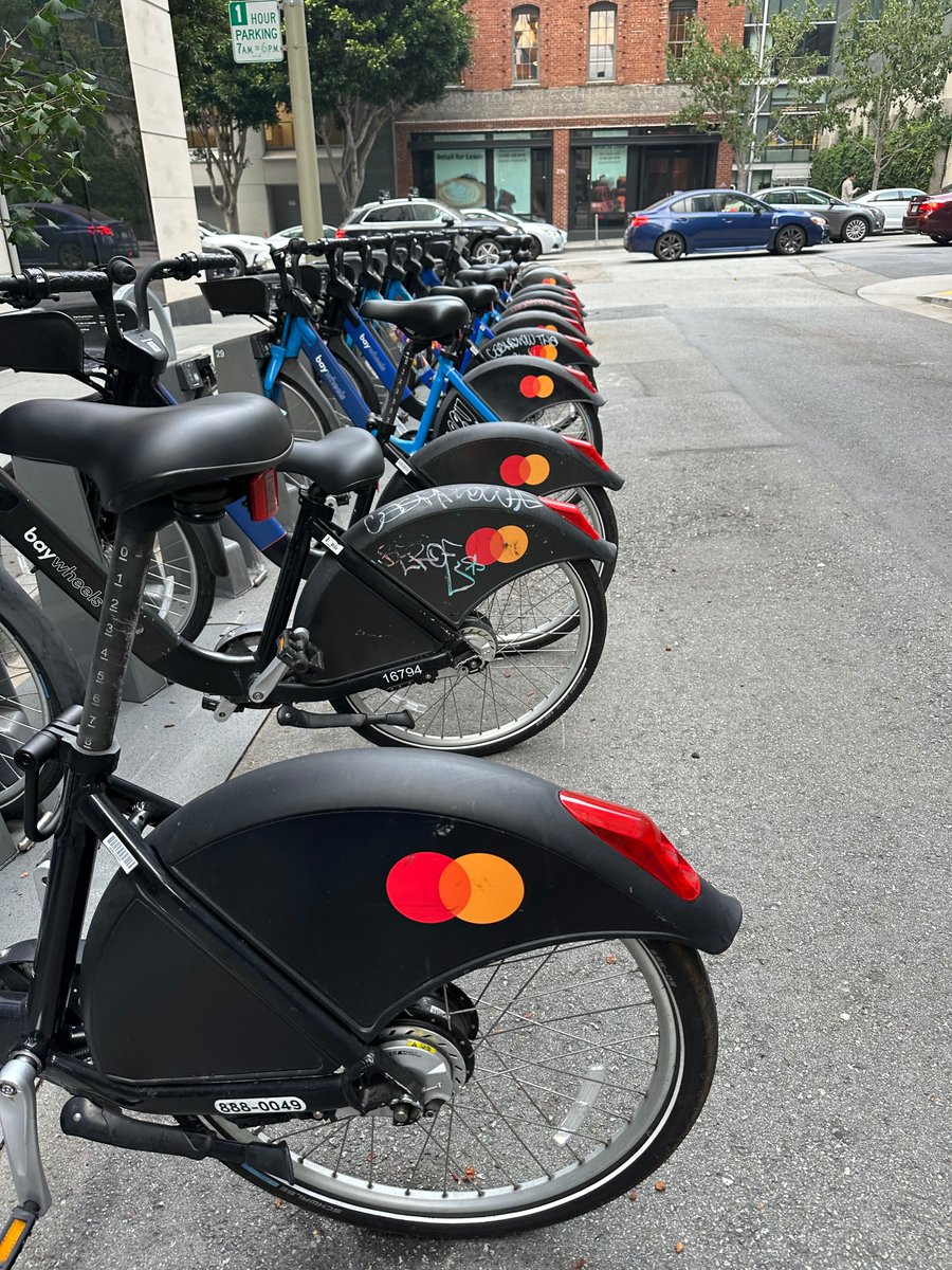 Took this pic outside our partner @SoFi offices in SF. Always nice when traveling to have @Mastercard circles greet me. Great to see urban mobility programs (with easy payments!) like this to help people get around. We help process payments for 1k+ bike-sharing systems worldwide!