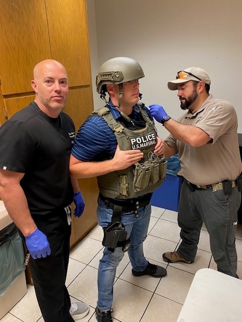 USMSFortSmith's tweet photo. Today, we partnered with @BaptistHealthFS and @SullyEMdoc Doctor Sullivan, a sworn Task Force Officer within our district, to provide free flu shots to USMS, Task Force and US Court staff.  We hope to expand our efforts next year!  Pictured are Doctor Sullivan and (A) USM Allen. https://t.co/sFLeiLZD0m