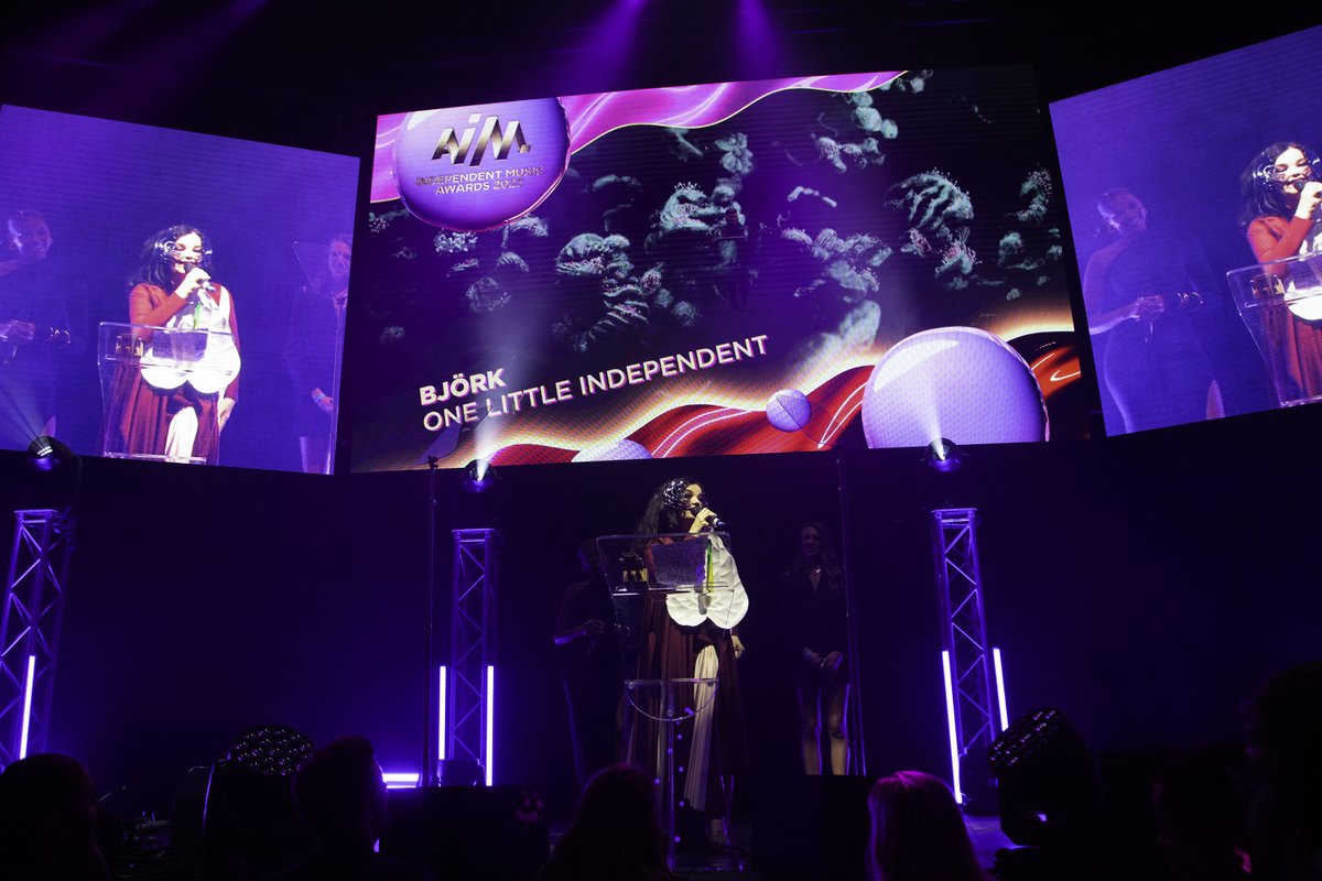 AIM_UK's tweet photo. It was an honour to have legendary musician &amp; visionary innovator, @bjork join us for the #AIMAwards2023 . She picked up the public voted award for Best Live Performer ✨

Huge congratulations to @bjork and the @onelittleindierecords team!

Photos: @santiagraphy https://t.co/2zkml0ED6s