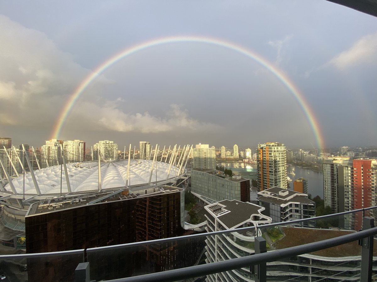 DakshThaper's tweet photo. Double rainbow (almost) in #Vancouver !!! @bcplace https://t.co/QpaXCPMGSP