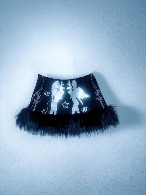 Made this jacket and skirt from different t-shirts. Added fur and rhinestones for the finished details