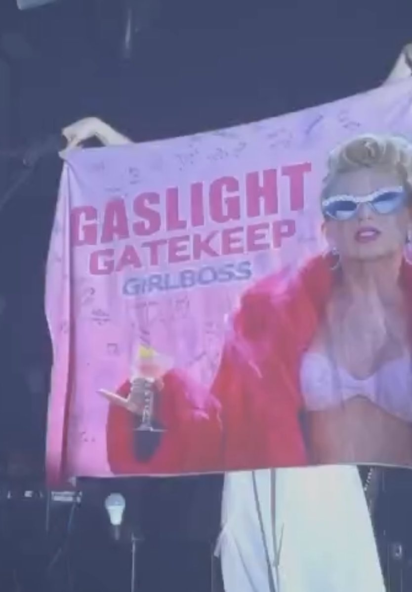 GracieAbrUpdate's tweet photo. #GRManchester: Gracie holding up a Taylor Swift “GASLIGHT, GATEKEEP, GIRLBOSS” flag tonight at the Academy in Manchester, UK. — 📸: @/libby.mcoxnn https://t.co/VMR3Y0OyIK