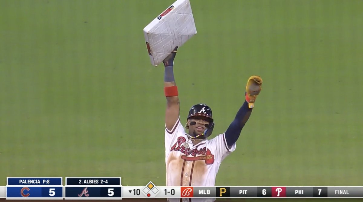 CespedesBBQ's tweet photo. Ronald stealing base number 70 and raising it up in the top of the 10th like a trophy while the Cubs are FIGHTING for their playoff lives is a very funny juxtaposition of vibes https://t.co/0GyMWX5pT5