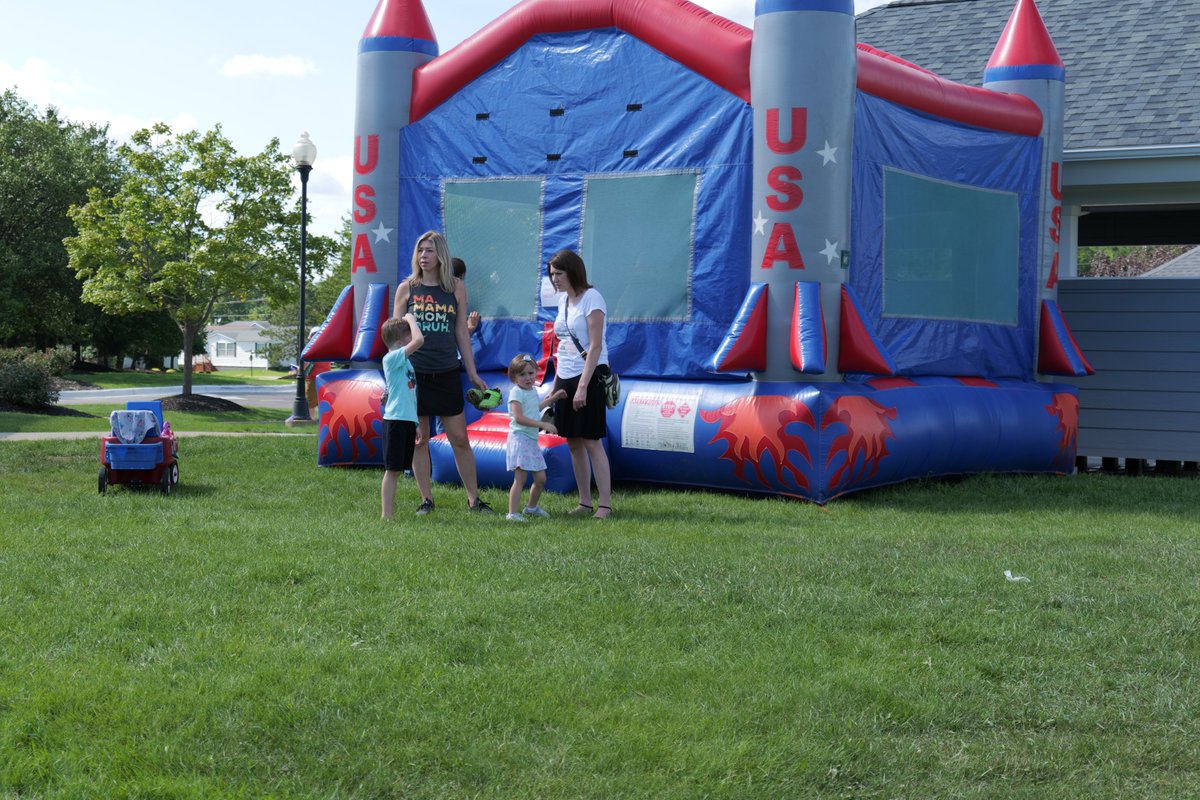 The bounce house with a couple of kids and parents in front of it. I think the youngest was inside it at that time. 
#bouncehouse #bounce #jumpingcastle #summerbbq #northvillecrossing #BBQ #eagleeyevideoproductions #llc #phto #photograph #photography #summerfun #eagleeye