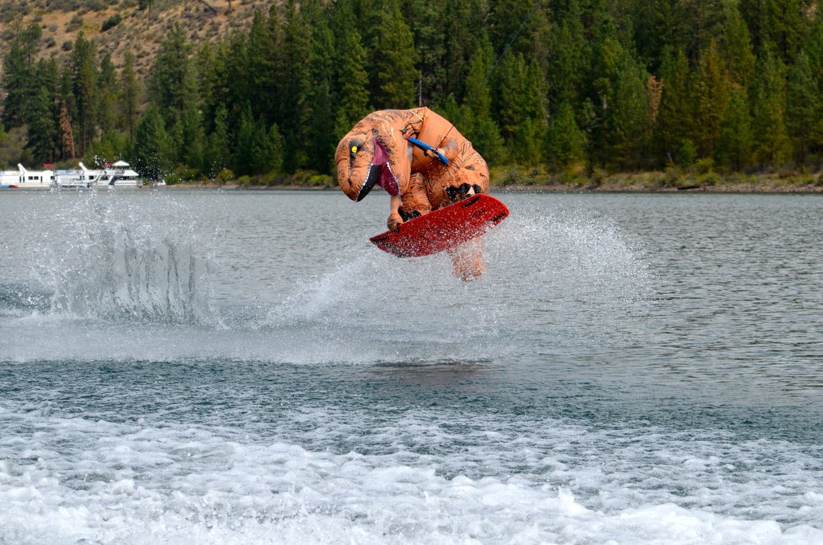 Dinosaurs extinct? Nope, just wake boarding on Lake Roosevelt! 🕶️