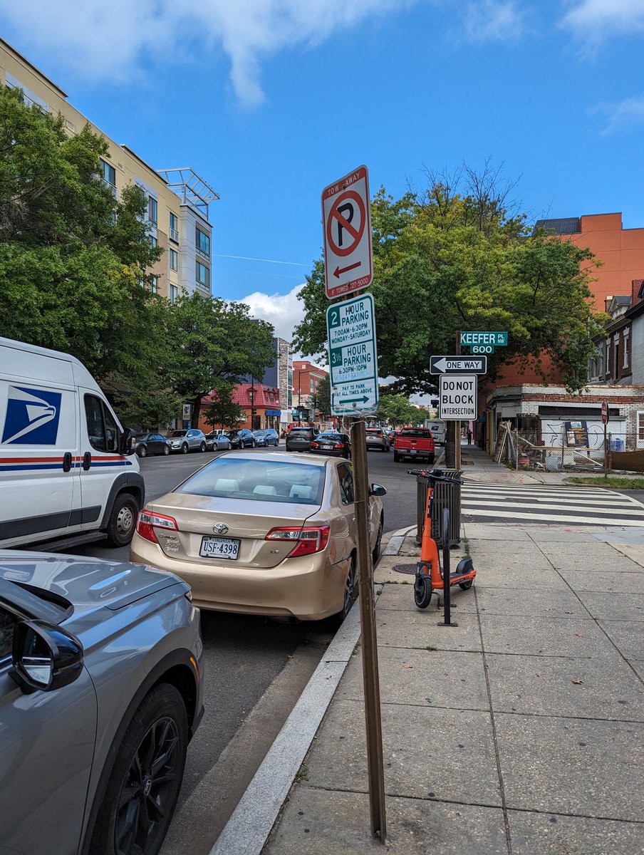 megjoyo's tweet photo. @311DCgov @BrianneKNadeau yet another car in the no parking spot on Georgia at Keefer. Can we get some bollards here to improve visibility and safety since people are routinely ignoring the sign? https://t.co/QpEX1nhNeg