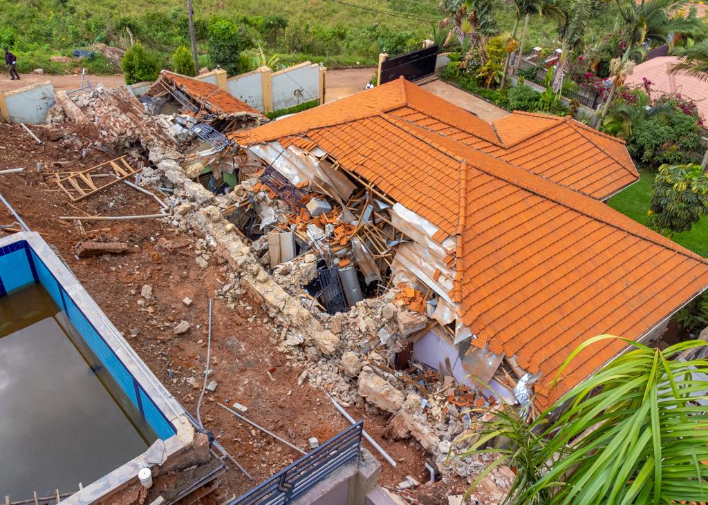 Kyengera Town Council and the National Building Review Board failed us. The pictures that precede this message are of my brother , Eugene’s house in Seguku . Yes, the one whose roof has been bashed in by a retaining wall. The wall in question, built by one Ismael Semakula poorly.