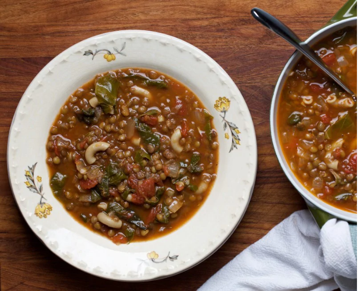 Ellie_Krieger's tweet photo. This comforting #lentil soup is flecked w/ greens, tomato &amp; elbow pasta and seasoned with a deeply flavorful but mellow mix of #MiddleEastern spices. It's a #onepotwonder that is perfect to #makeahead. https://t.co/Uovwp6U2Yv #soup #swisschard https://t.co/gO3KA839nl