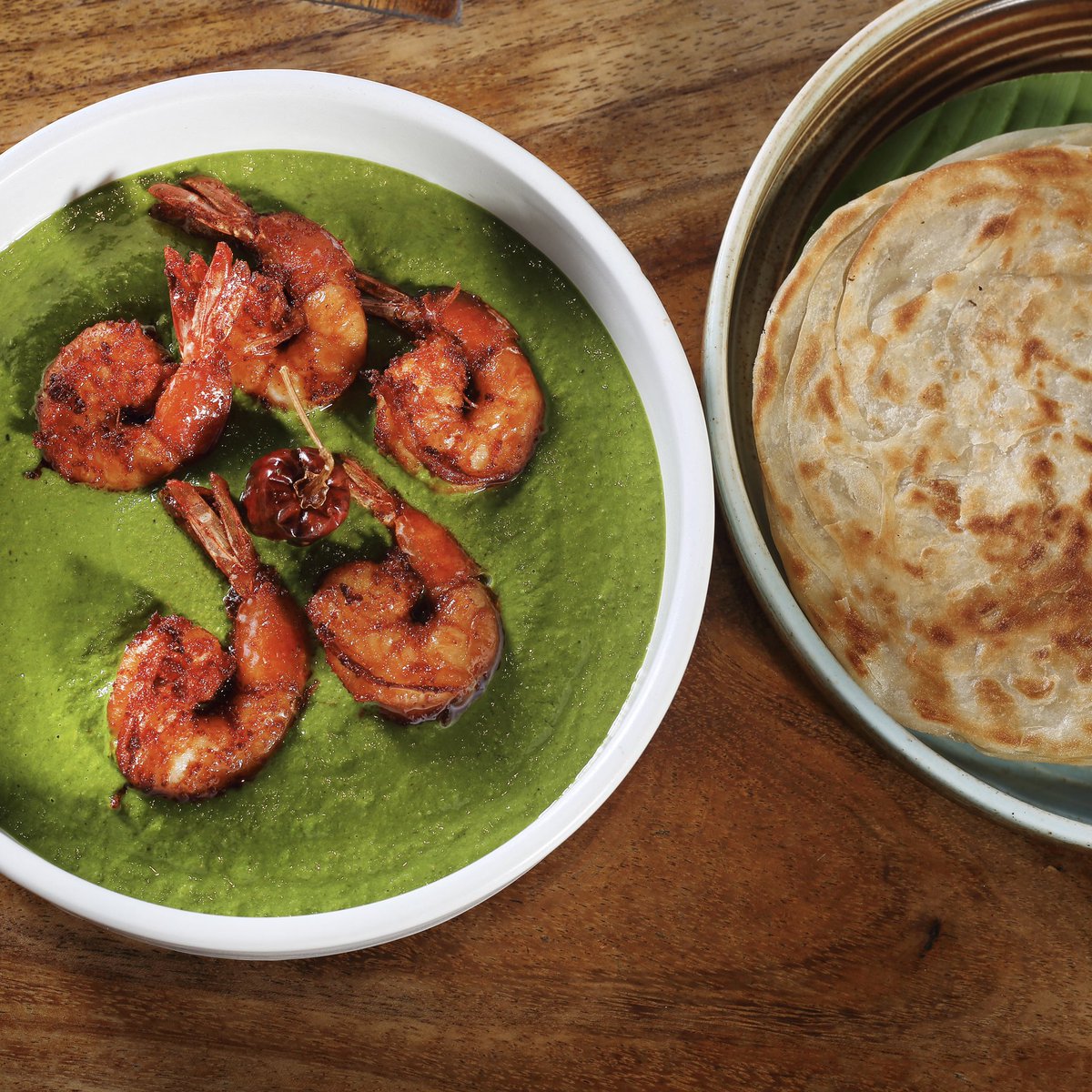 Dive into the rich tapestry of Indian regional food with the delectable pairing of our Nilgiri Masala Prawns with Malabar Parotta 🍽

The flaky layers of the parotta lend the perfect bite to our flavourful curry, making each bite irresistible.

#ComeOnIn