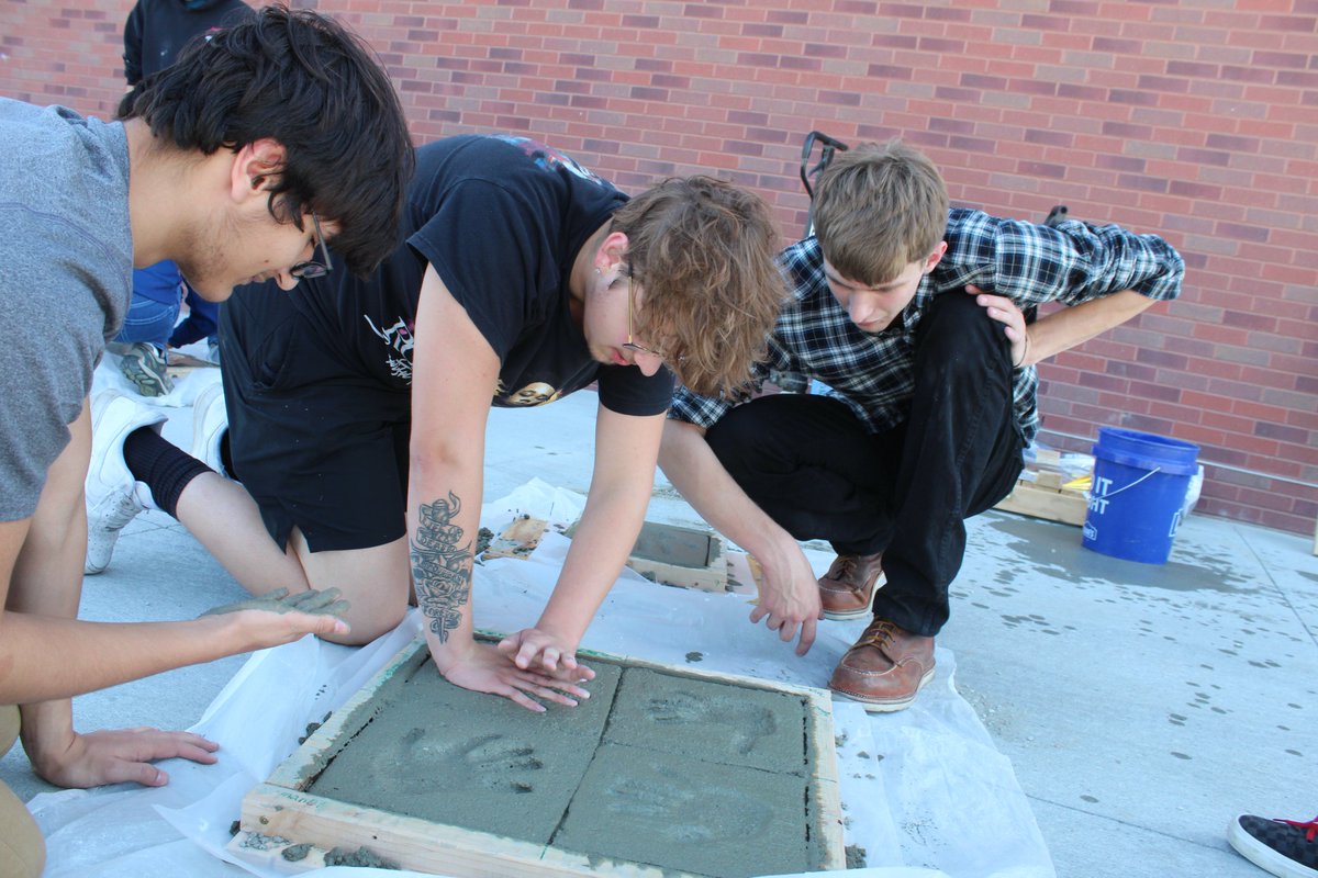 SchoolsPlc's tweet image. Students in Mr. Horak's Construction class @plpulse  learned how to mix and set concrete today! And yes, once they demonstrated  appropriate skill and technique for setting their team's concrete block, they did get to leave their handprints! #PLCSGreat