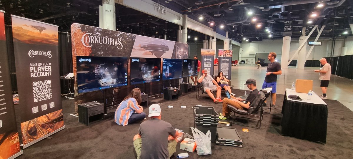 RobGreig3's tweet photo. Almost finished setting up the @CornucopiasGame booth for #NFTxLv , downloading the latest game now... #LasVegas2023 #CardanoCommunity https://t.co/Vz6Gqlj8Ie