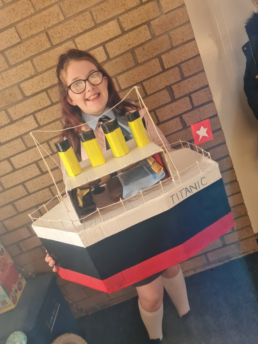 Babycat02's tweet photo. The happiest wee lady heading into school this morning with her Titanic. Our Rosie does love a crafty project @HolyFamily_PS https://t.co/Vu4IkVBeWE
