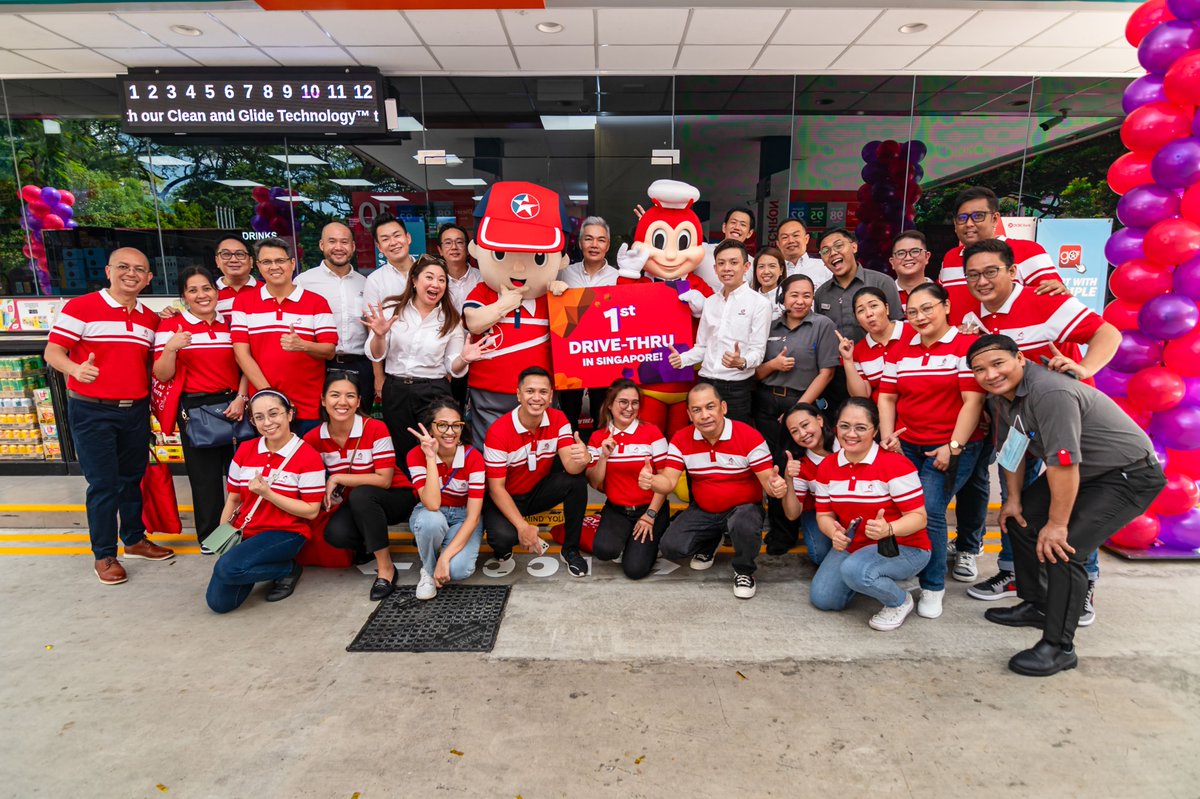 Jollibee's tweet photo. We’re bringing more #ChickenjoyToTheWorld! Jollibee has once again made a mark overseas as it opened its first drive-thru store in Singapore at the Caltex Jurong Spring station last September 19. 🍗

Here are some photos from the joy-filled store opening! https://t.co/h0IbA9w3cu