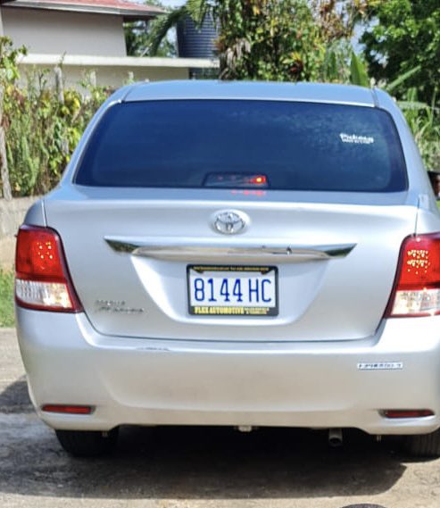simply_tass's tweet photo. Silver Toyota Axio stolen near the Bonitto Cresent area early this morning in Mandeville license plate 8144 HC . There’s a “pickney inna di car” sticker on the glass at the back. 

Please share and if you have any info please DM or contact the Mandeville police station. 🙏🏽 https://t.co/G66mBqqs08