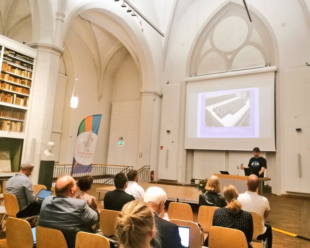 LibraryAAC's tweet photo. Old meets new today at #TextplusPlenary 2023: a pic of a #Commodore64 in @torstenroeder's presentation on archiving #diskmags, next to centuries of leather-bound tomes in the historical building of @subugoe - a perfect illustration of the wide spectrum of @Textplus_NFDI! π https://t.co/nVtsWPNjty