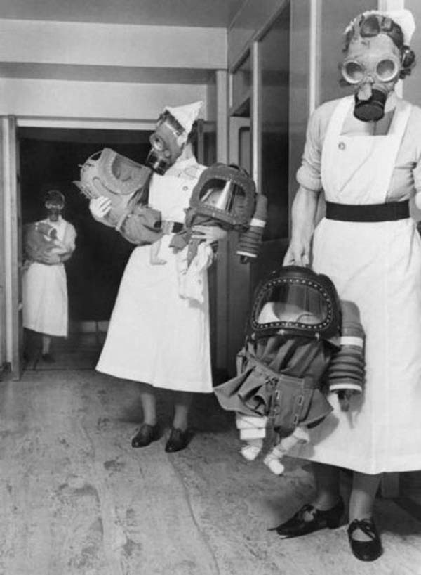 YesterdayToday9's tweet photo. Infants wear gas mask hoods during a London bombing drill, 1940.
#YesterdayToday https://t.co/iAthuR8zNn