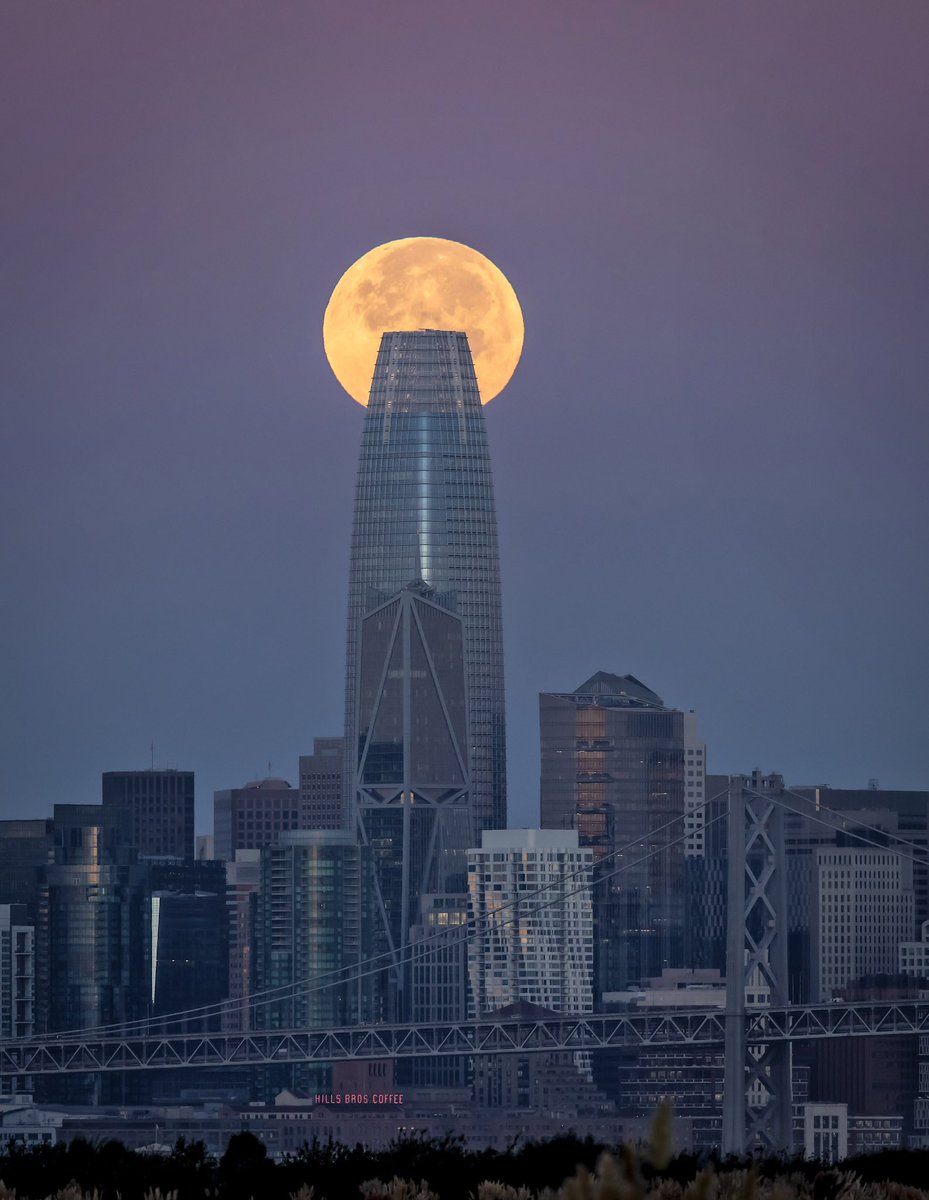 The full harvest supermoon sets behind the San Francisco skyline as seen from Alameda, Calif., on Friday, September 29, 2023. September’s supermoon is the fourth and final supermoon of 2023 and was the second closest to earth of the year. #supermoon #sanfrancisco #sf #sfskyline