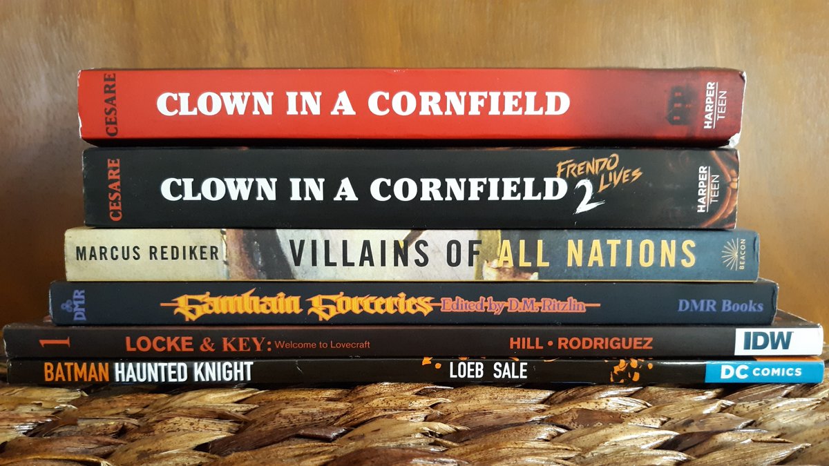 #bookmail My complete stack of Halloween reading: 

CLOWN IN A CORNFIELD 1/2 by @Adam_Cesare 
VILLIANS OF ALL NATIONS by @MarcusRediker 
SAMHAIN SORCERIES from @dmrbooks 
BATMAN: HAUNTED KNIGHT by Jeph Loeb
LOCKE AND KEY VOL. 1 by @joe_hill